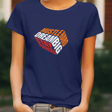Navy blue female t-shirt with 'Hustle Hard Dream Big Stay Focused' graphic design on the front.