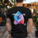 Black unisex t-shirt with a "Cosmic Positive Vibes" psychedelic graphic on the back.