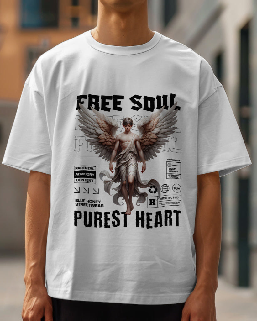 A male model wearing an oversized "Free Soul, Purest Heart Graphic" Half Sleeve White T-Shirt