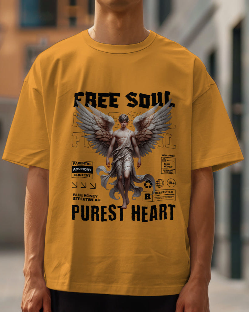 A male model wearing an oversized "Free Soul, Purest Heart Graphic" Half Sleeve Golden Yellow T-Shirt