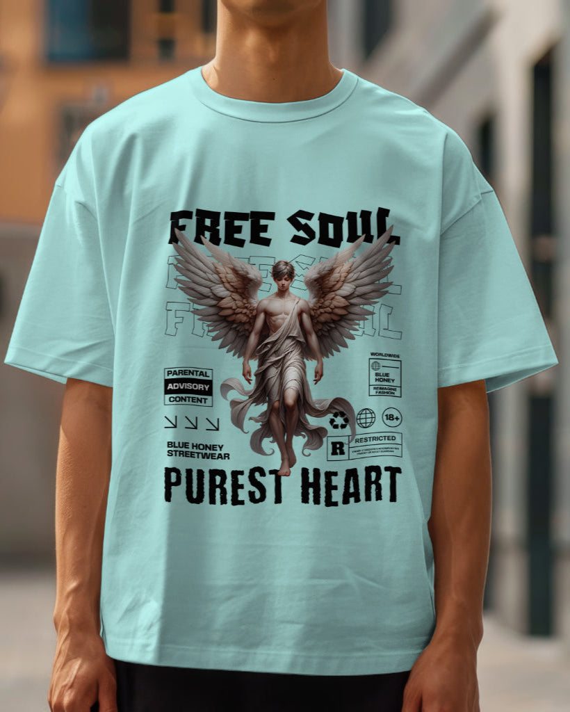 A male model wearing an oversized "Free Soul, Purest Heart Graphic" Half Sleeve Mint T-Shirt