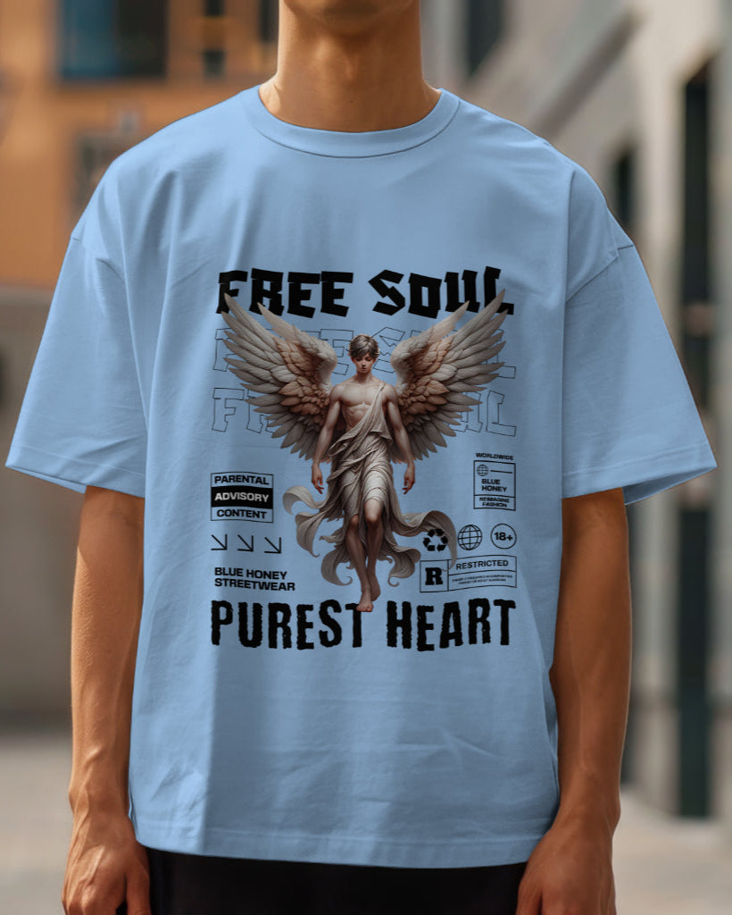 A male model wearing an oversized "Free Soul, Purest Heart Graphic" Half Sleeve Baby Blue T-Shirt