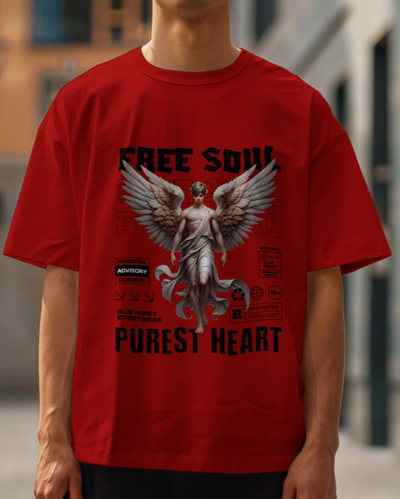 A male model wearing an oversized "Free Soul, Purest Heart Graphic" Half Sleeve Red T-Shirt