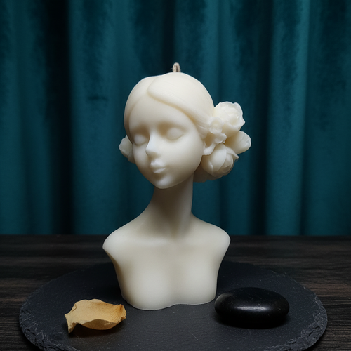 White Bloom Maiden bust candle with floral accents, displayed on a slate coaster.