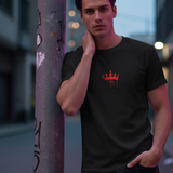 Man wearing a black 'Wear the Crown. Own the Hype' unisex crew t-shirt with a red crown graphic.