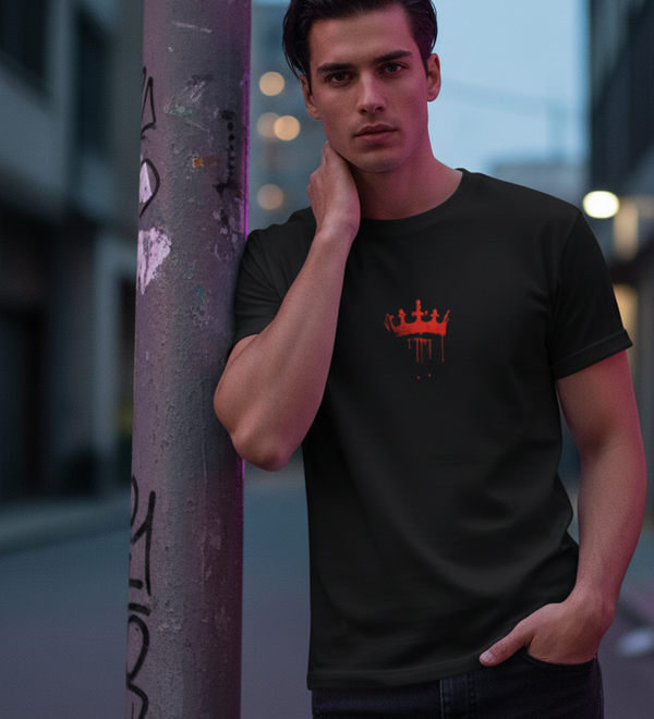 Man wearing a black 'Wear the Crown. Own the Hype' unisex crew t-shirt with a red crown graphic.