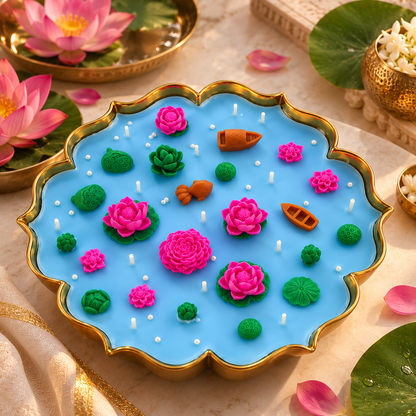 Lotus pond urli candle on a marble table with pink lotus flowers, lily leaves and jasmine in brass bowls