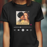 Front view of an oversized black unisex t-shirt featuring a Veer Zaara song graphic with playback controls.