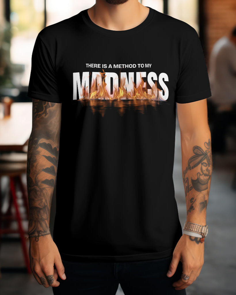 A model with tattoos wearing 'There is a method to my madness' black t-shirt.