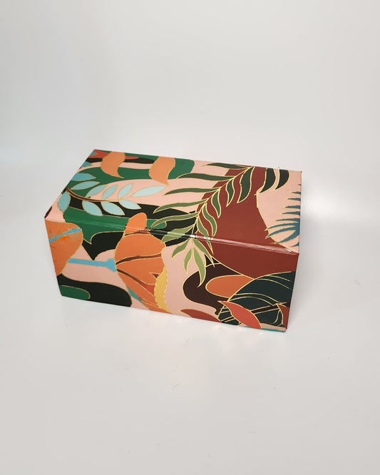 Rectangular box with a colorful leaf pattern on a white background