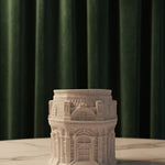 The Grand Pavilion Architectural Jesmonite Candle Jar in white, showcasing intricate building details, presented front-on.