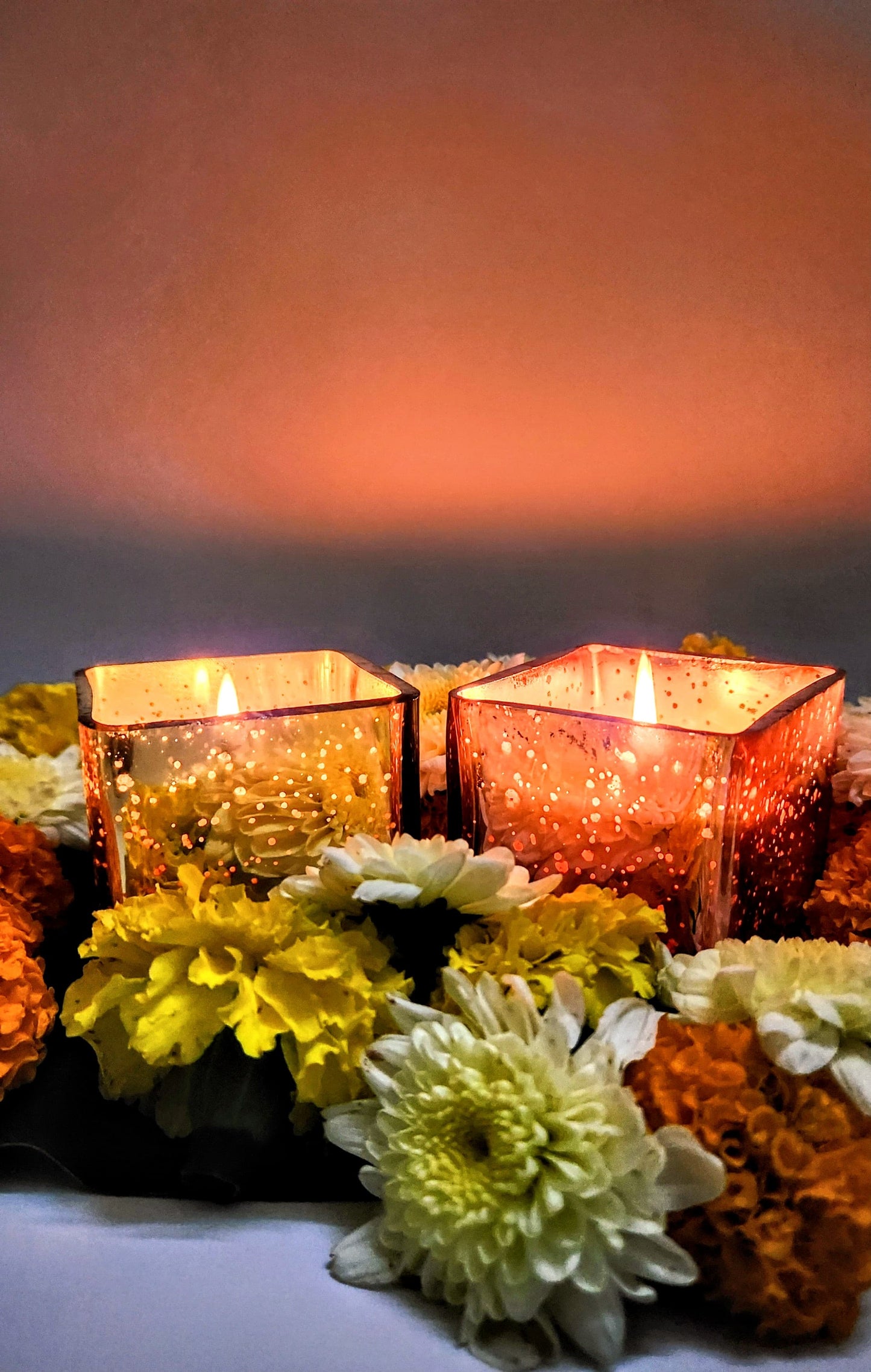 illuminated rose gold and gold glass jar candle