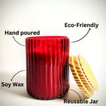 Ruby Glow scented candle in a red ribbed glass jar, hand-poured soy wax, eco-friendly and reusable.