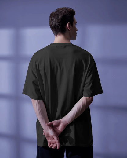 back view of a white model standing wearing the black Thalassophile tshirt 