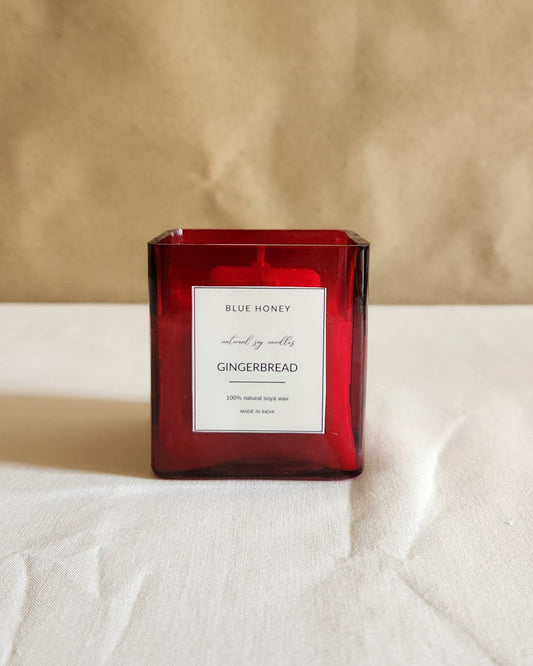 blue honey red cuboid shaped glass jar candle label reads Ginger bread.