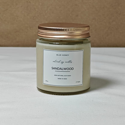 Mason jar with gold lid, label reads Sandalwood scented.