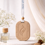 Sandalwood car aroma tag hanging with a blue ribbon and wooden bead, featuring a flame design.