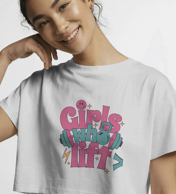 White crop top with 'Girls Who Lift' graphic featuring dumbbells and a kettlebell, front view.
