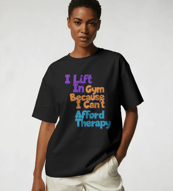 Black unisex crew neck t-shirt with 'I lift in Gym Because I Can't Afford Therapy' graphic print.