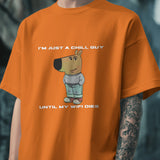Orange cotton graphic tee featuring a cartoon dog and the text 'I’m Just a Chill Guy… Until My WiFi Dies'.