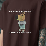 Brown "I’m Just a Chill Guy… Until My WiFi Dies" graphic tee with a cartoon dog wearing a sweater and jeans.