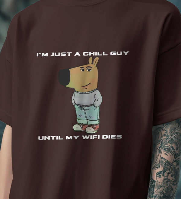 Brown "I’m Just a Chill Guy… Until My WiFi Dies" graphic tee with a cartoon dog wearing a sweater and jeans.