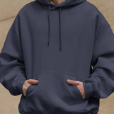 Dreamin' oversized unisex hoodie in navy, featuring a comfortable fit and casual streetwear style.