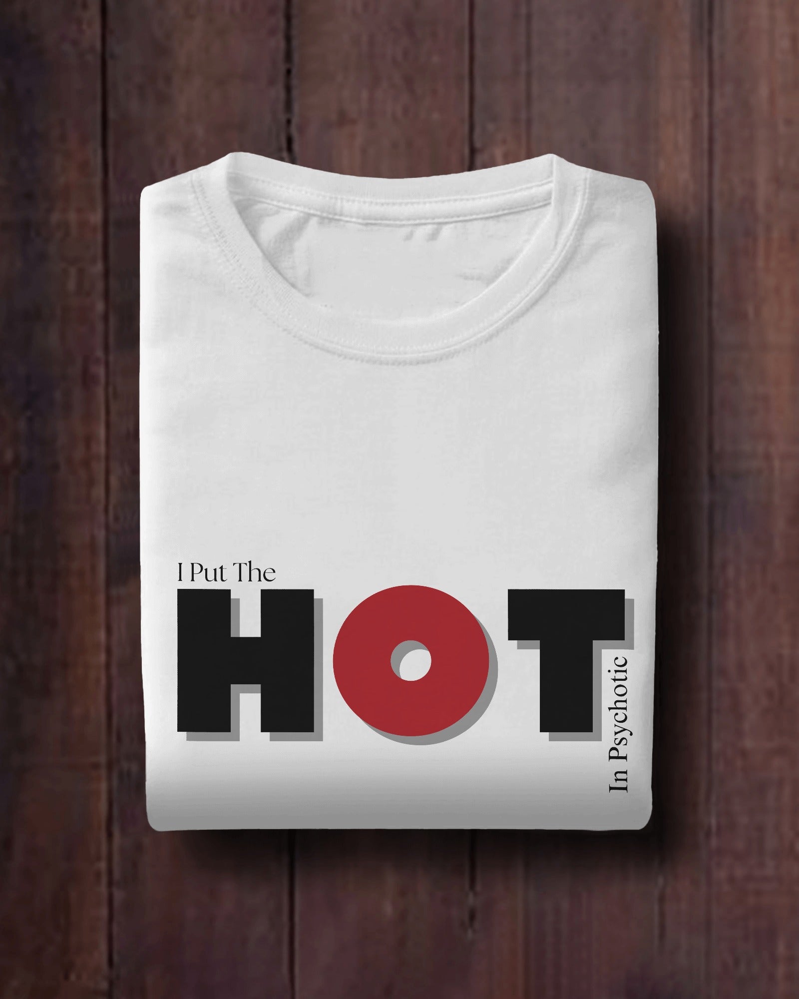 a folded white classic half sleeve round neck I put the hot in psychotic graphic t-shirt. 