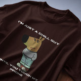 Men's brown graphic tee with 'I’m Just a Chill Guy… Until You Touch My Phone' quote and cartoon dog print.