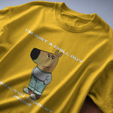Men's yellow "I’m Just a Chill Guy… Until You Touch My Phone" graphic tee featuring a cartoon character.