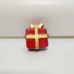 Hand-painted miniature red and gold cement Christmas gift box fridge magnet, perfect for festive decor.