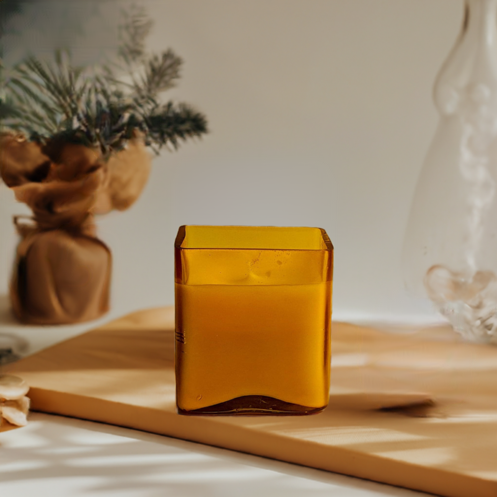 Yellow cuboid-shaped glass jar candle with decor