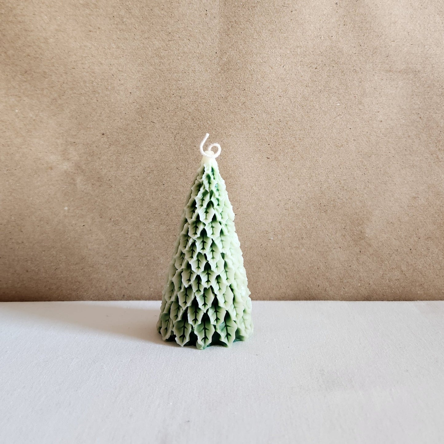 green Christmas tree soy wax candle with white frosting