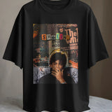 Black t-shirt featuring a "SMOKING" graphic with a portrait of a man smoking.