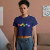 Navy blue Rainbow Bloom crop top with colorful flowers, worn by a woman in a casual setting.