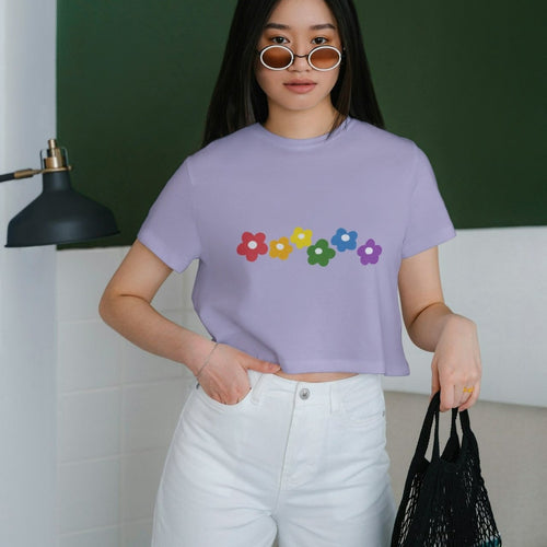A young woman models the Rainbow Bloom Crop Top, a vibrant and stylish casual wear piece.