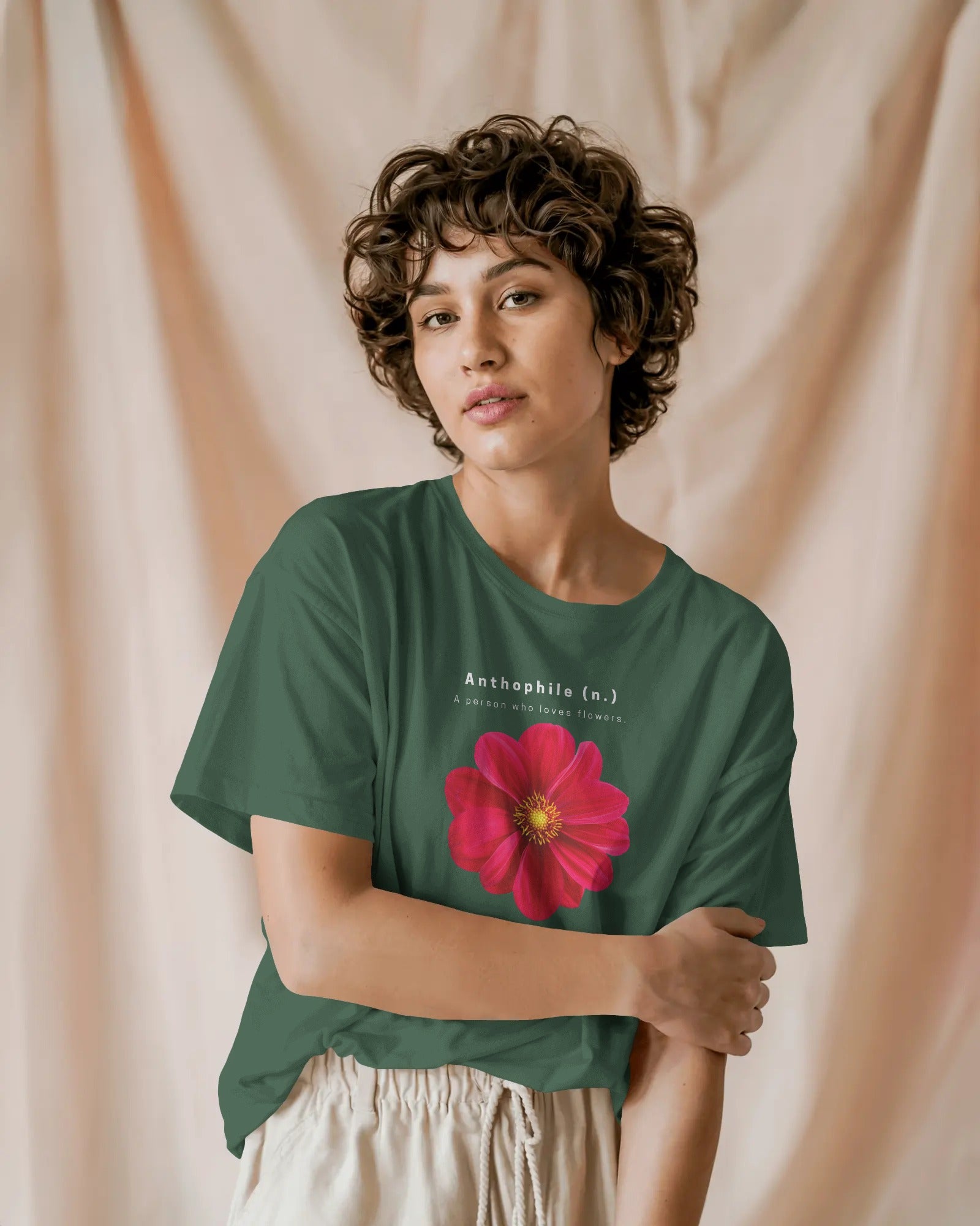 a female model standing wearing an oversized Bottle Green Anthophile tshirt 