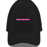 Front view of a black unisex Sunphobic sports cap with pink lettering on the front.