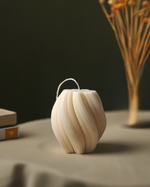 Eco-friendly 4" soy wax swirl pillar candle in a clean burn design, presented from a front view.