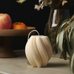 Eco-friendly 4" soy wax swirl pillar candle in a creamy white color, offering an elegant and clean burn.