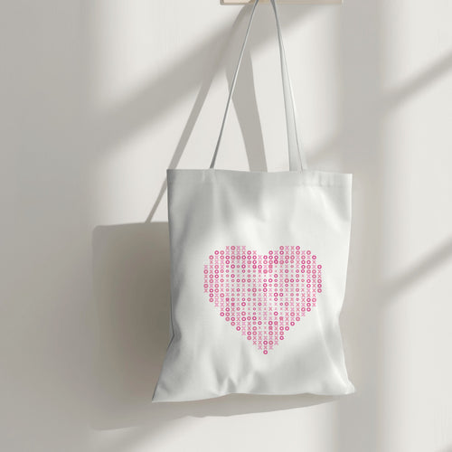 White canvas tote bag with a pink 'XOXO' heart design, perfect for shopping or everyday use.