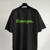 Black oversized t-shirt featuring 'Escape' in a green maze-like typography design, front view.