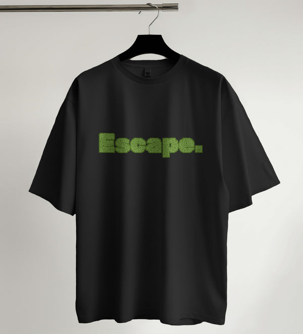 Black oversized t-shirt featuring 'Escape' in a green maze-like typography design, front view.