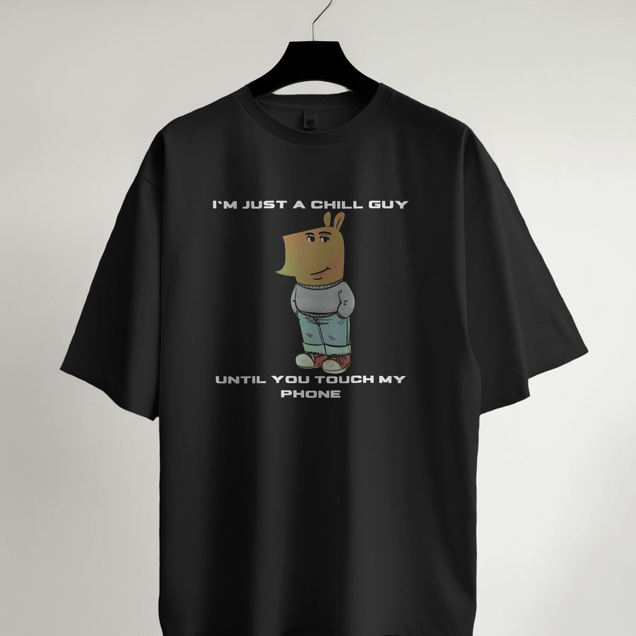 Black cotton graphic tee for men featuring a cartoon character and the quote 'I'm Just a Chill Guy... Until You Touch My Phone'.