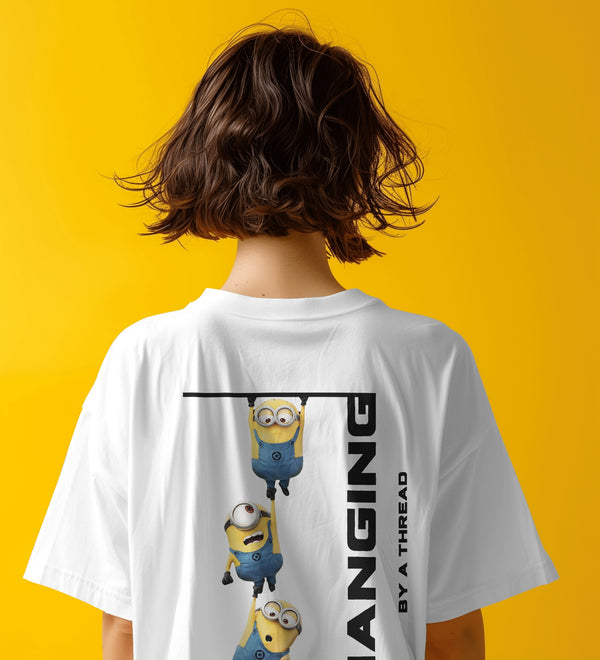Back view of a white unisex t-shirt featuring Minions hanging by a thread with text that reads 'HANGING BY A THREAD'.